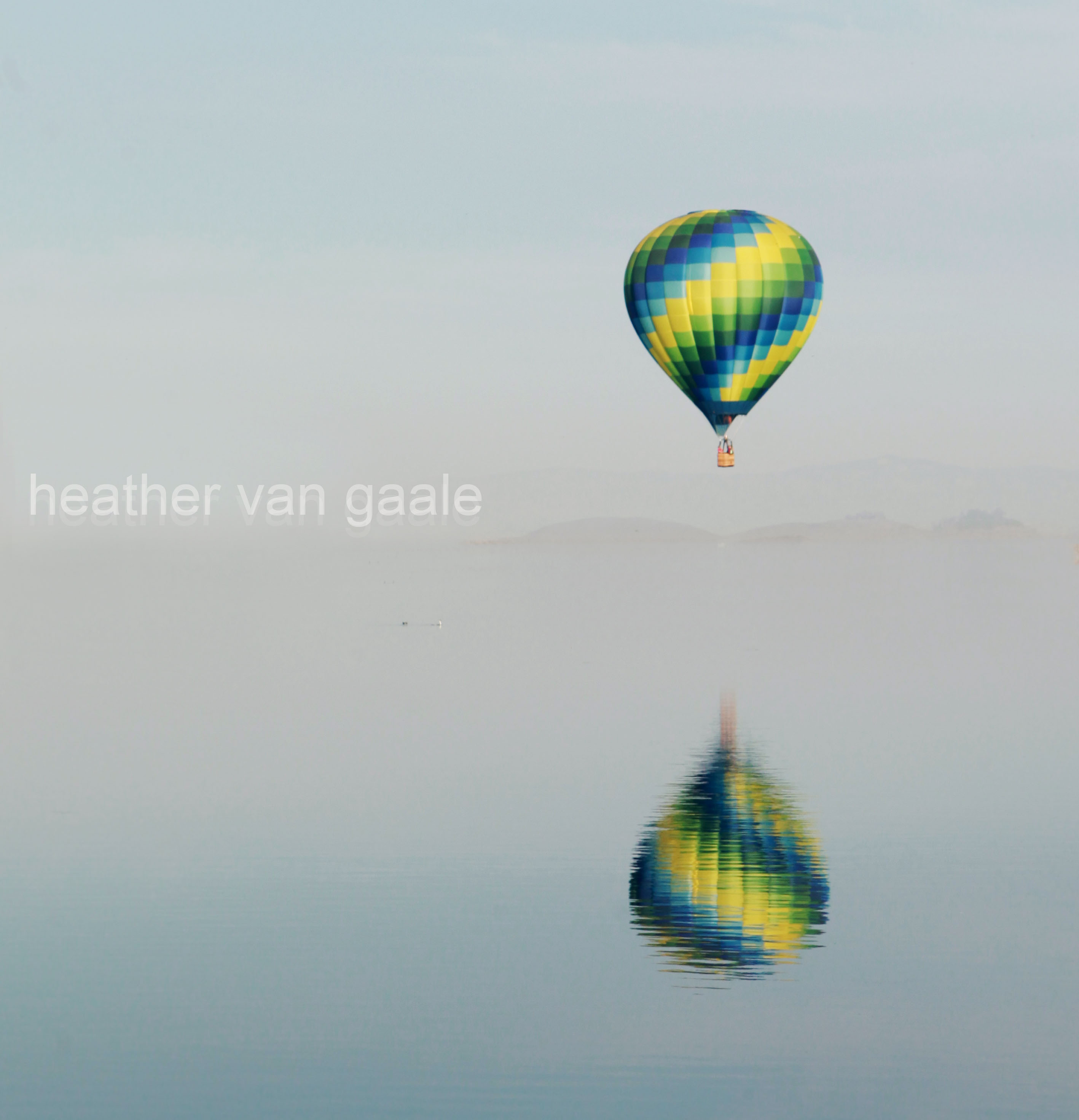 hot air balloon over lake skinner with reflection by heather van gale